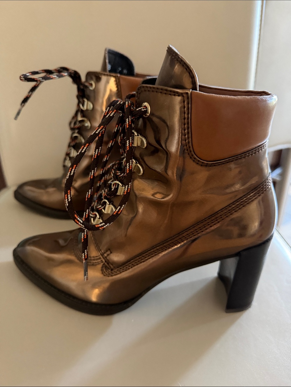 Stuart Weitzman x Gigi Hadid Metallic Copper Lace-Up Ankle Boots
